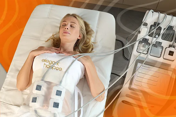 Client lying on treatment bed with truSculpt ID applicators on their abdomen for non-invasive cellulite and fat-removal therapy
