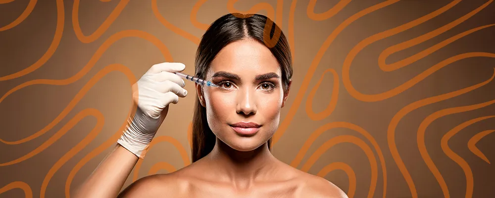 woman receiving filler treatment under the eyes