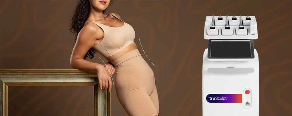 Woman in beige shapewear leaning on a frame next to a truSculpt device.