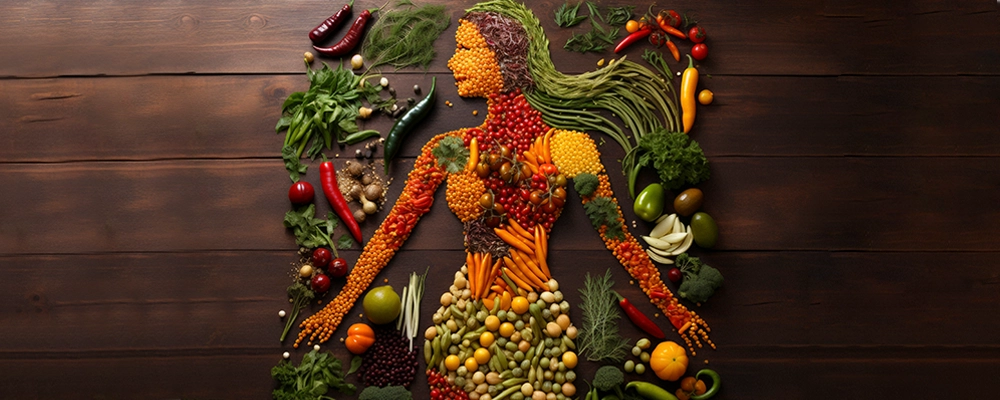 Artistic human figure made from colorful vegetables, symbolizing the best foods and vitamins for reducing cellulite and improving skin health.