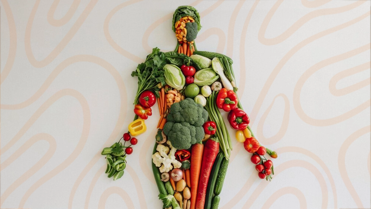 Creative human figure made from assorted fresh vegetables, symbolizing healthy foods that help reduce cellulite naturally.