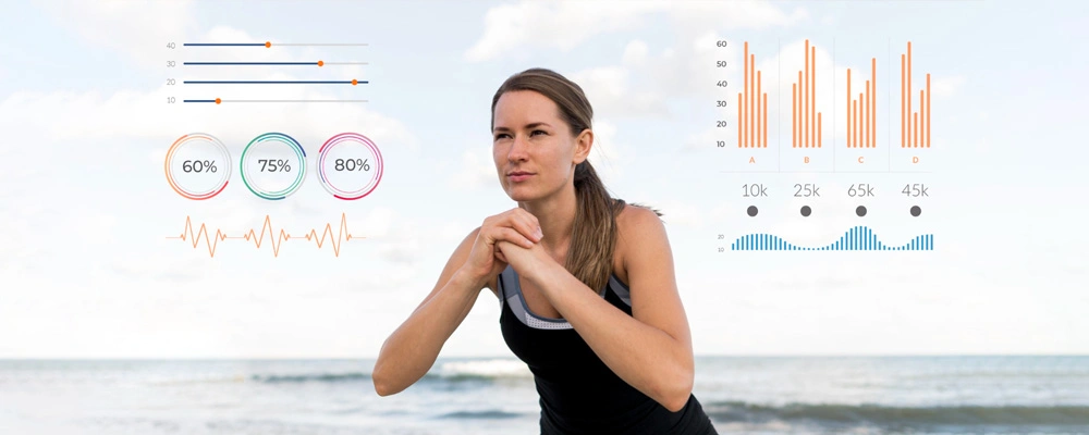 Fit woman reviewing BMI charts and body-water-percentage gauges during seaside exercise
