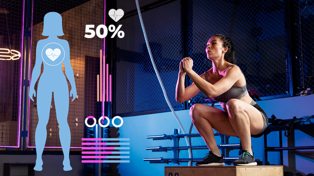 Woman doing box squats in gym as 50 % body-water overlay appears