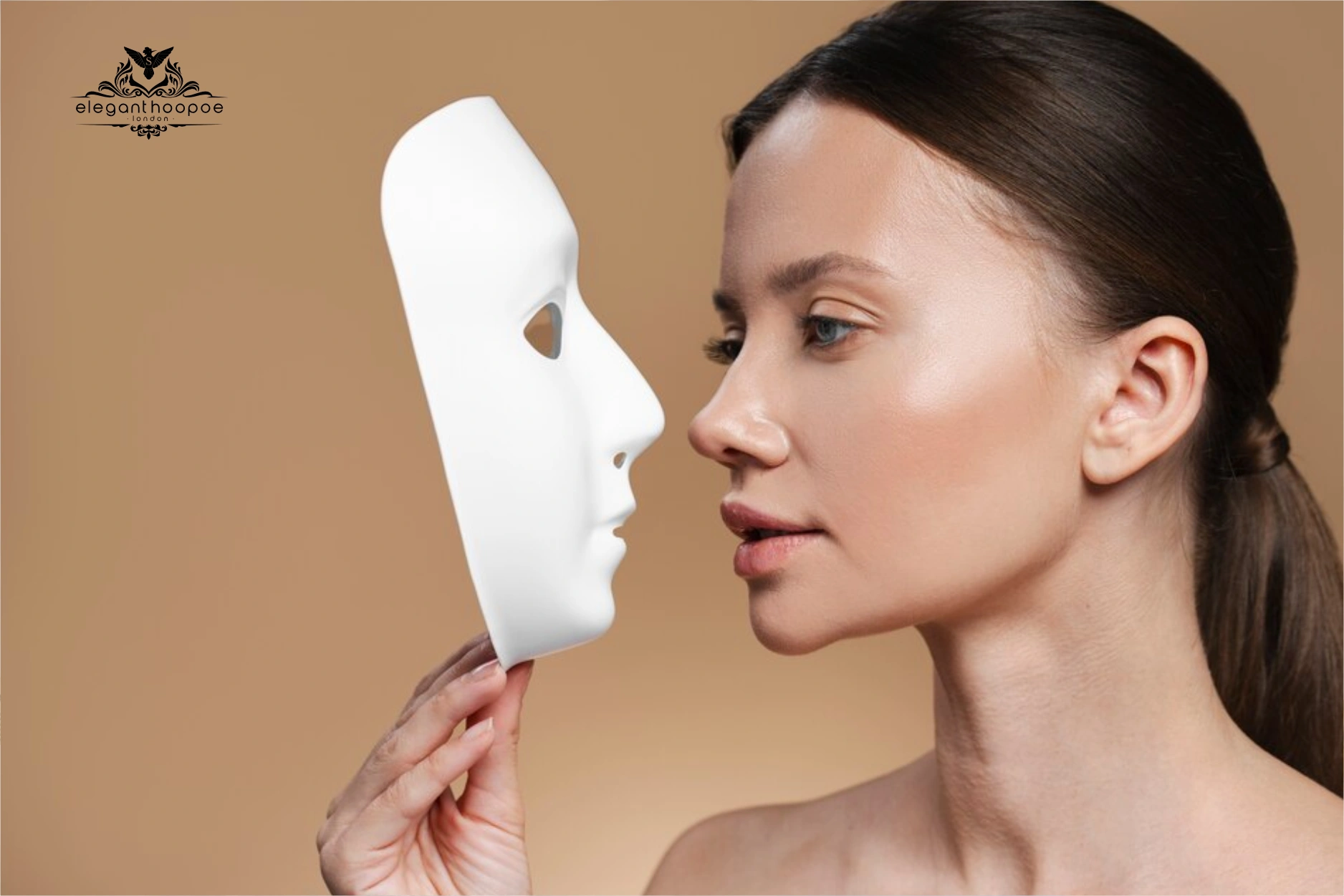 Woman holding a symmetrical face mask representing golden ratio standards