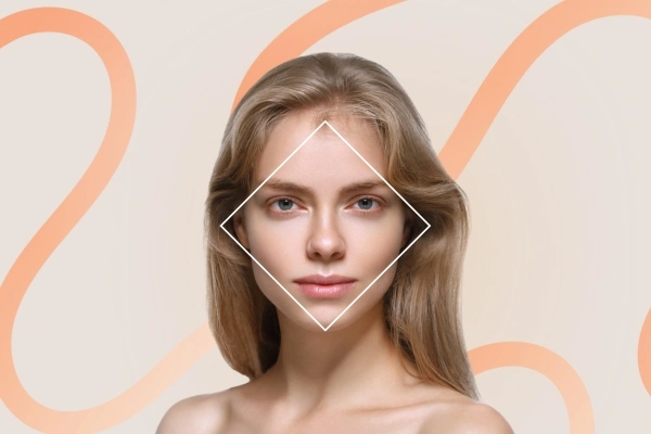 Blonde woman framed by a diamond outline emphasizing wide cheekbones and tapered chin	