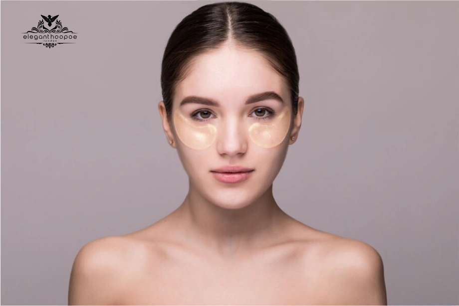 Woman with gold under-eye patches to highlight balanced facial features