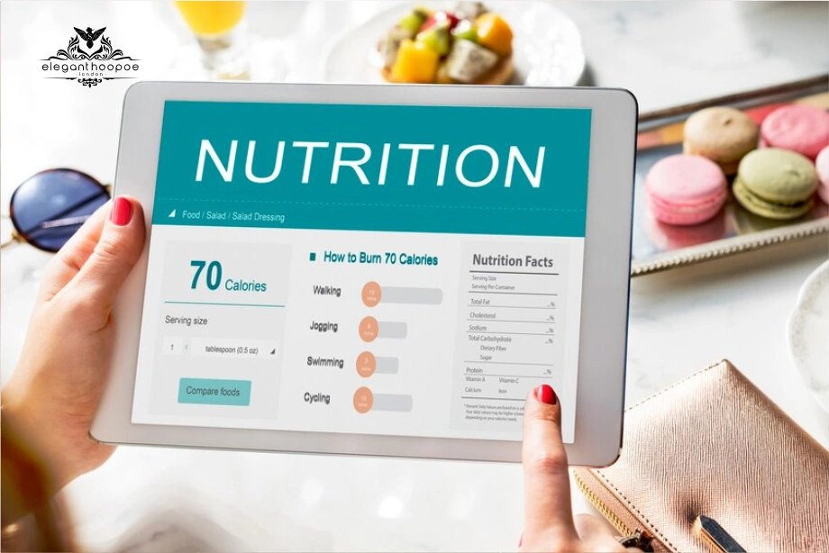 Tablet displaying nutrition tracker and calorie-burn chart beside healthy snacks. 
