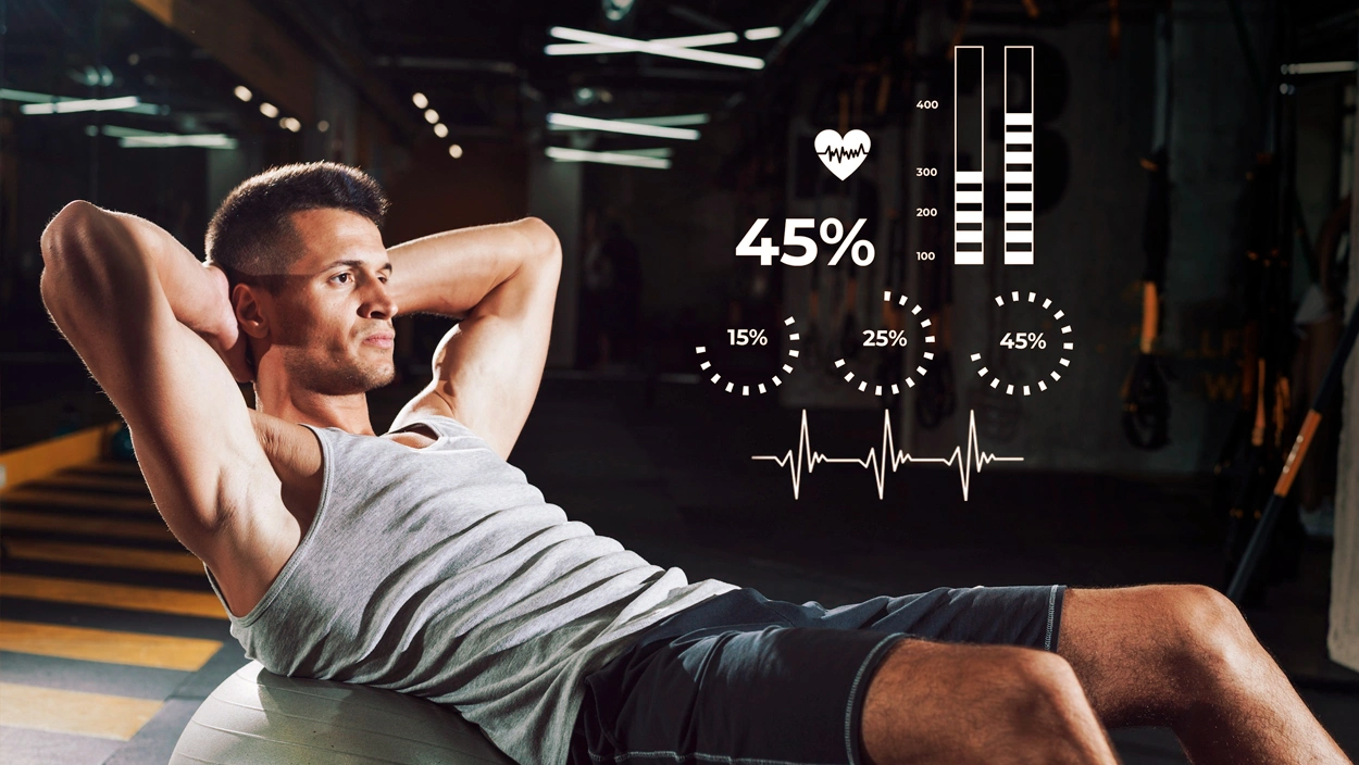 Athletic man performing crunches on a stability ball with BMI and body-composition stats overlay