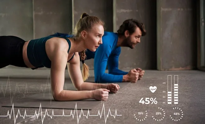 Man and woman holding plank position while BMI body-composition graphics display muscle-fat ratios