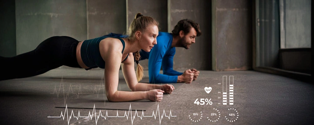 Man and woman holding plank position while BMI body-composition graphics display muscle-fat ratios