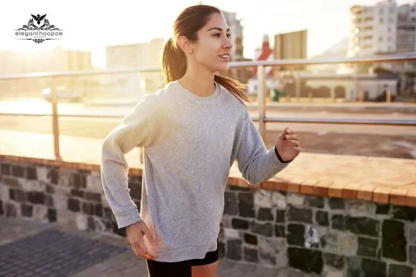 Woman jogging outdoors as part of maintaining a healthy BMI