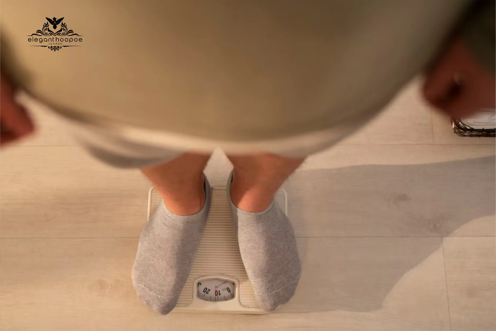 Individual standing on a white bathroom scale, illustrating BMI measurement and the height-related impact on higher BMIs in shorter people.