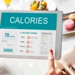Tablet screen showing calories and burn chart, illustrating how a body fat percentage calculator helps balance intake vs. expenditure
