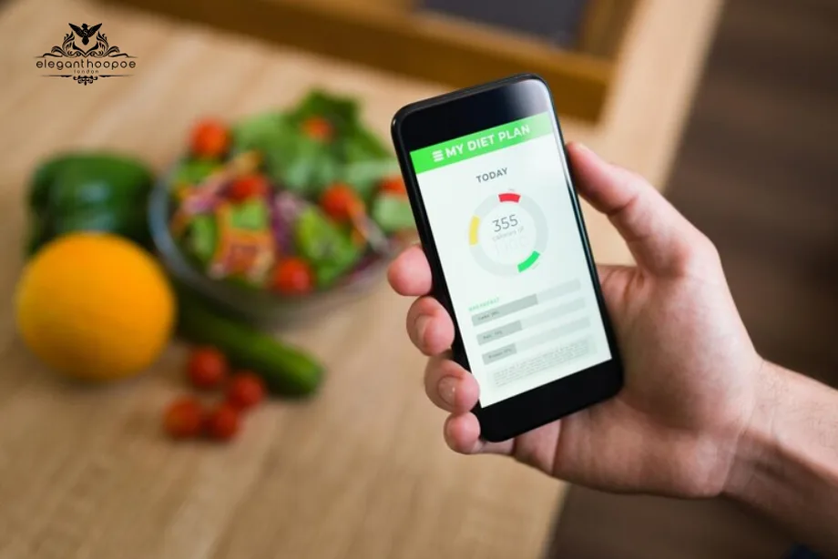 Smartphone showing calorie tracking app with fresh salad and vegetables in background, symbolizing digital health monitoring.