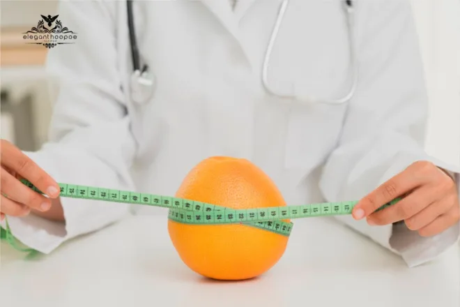 Doctor in a white coat measuring an orange with a green tape measure, illustrating the BMI calculation and the height impact on BMI.
