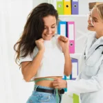 Healthcare professional measuring waist circumference to illustrate precise body composition analysis