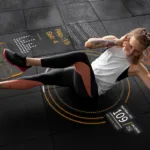 Person performing a crunch on gym floor with overlays showing reps, sets, heart rate, and calories burned