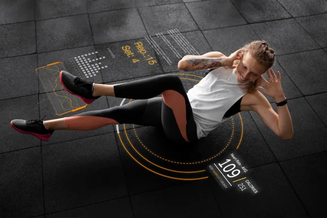 Person performing a crunch on gym floor with overlays showing reps, sets, heart rate, and calories burned
