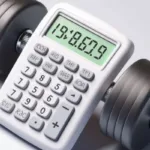 White calculator displaying numbers alongside a grey adjustable dumbbell on a light grey background
