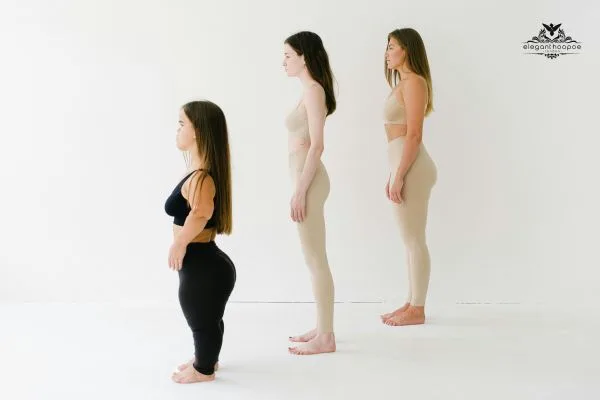 Three women with different body shapes standing side by side to represent underweight, normal, and overweight BMI categories